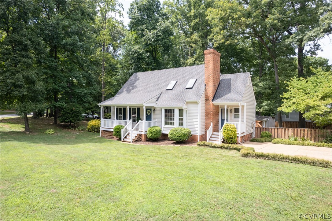 12000 Quito Road Midlothian, VA 23112 - Photo 1 of 36 a front view of a house with a yard patio and fire pit