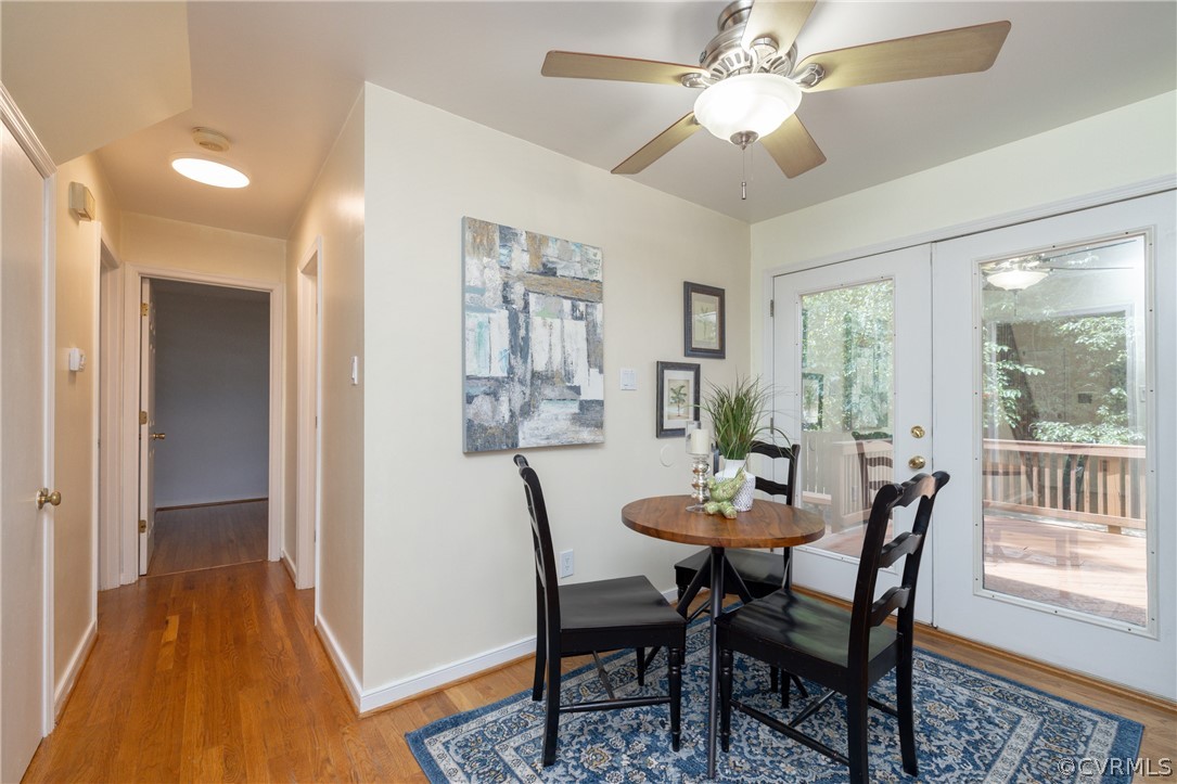 12000 Quito Road Midlothian, VA 23112 - Photo 15 of 36 a dining room with furniture a chandelier and wooden floor