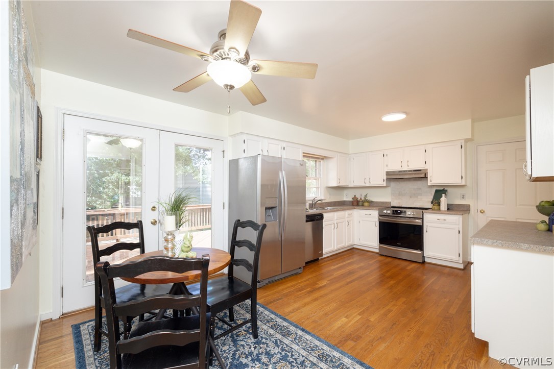 12000 Quito Road Midlothian, VA 23112 - Photo 16 of 36 a kitchen with refrigerator a sink and chairs