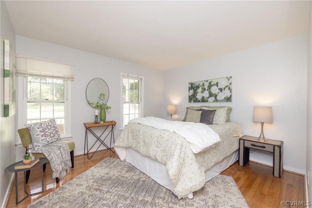 12000 Quito Road Midlothian, VA 23112 - Photo 18 of 36 a bedroom with a bed and wooden floor