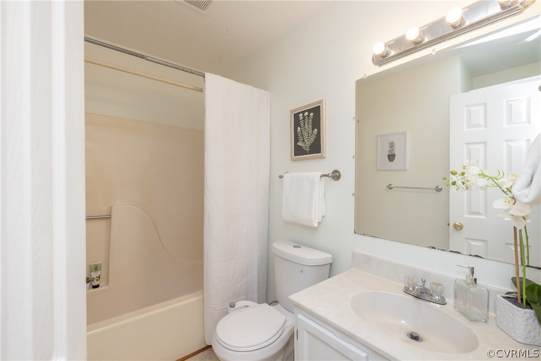 12000 Quito Road Midlothian, VA 23112 - Photo 21 of 36 a bathroom with a sink a toilet and shower
