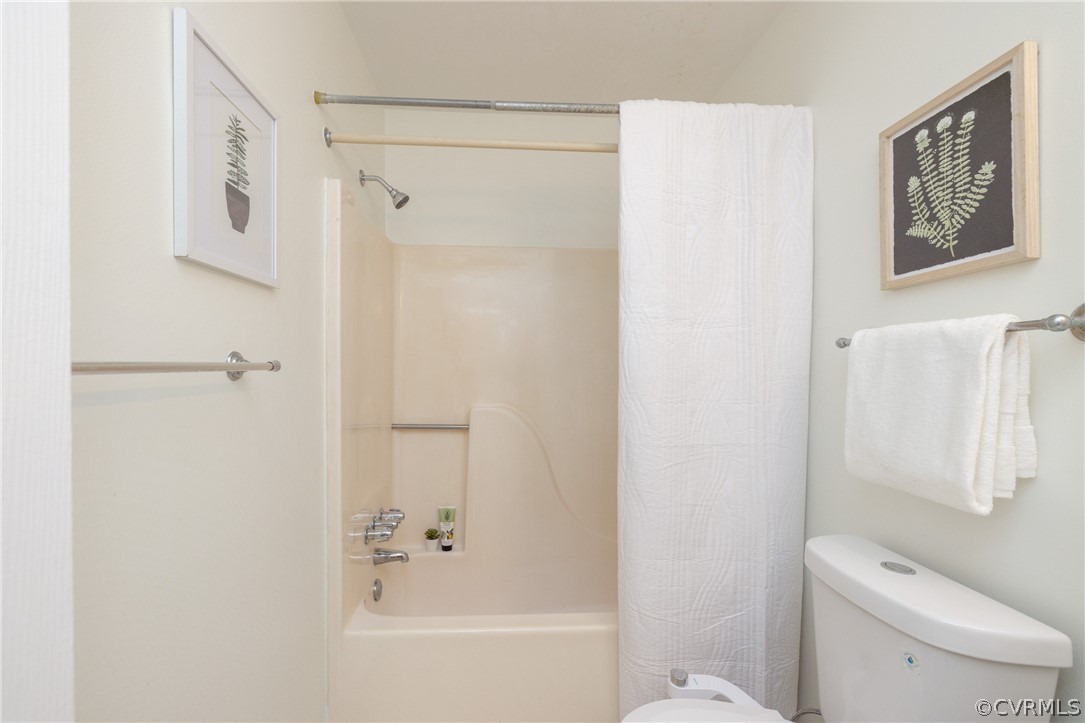 12000 Quito Road Midlothian, VA 23112 - Photo 22 of 36 a white toilet sitting next to a bath tub