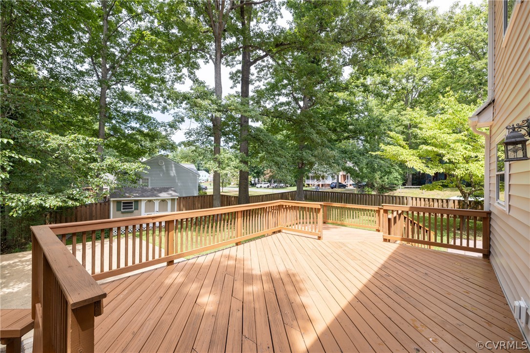 12000 Quito Road Midlothian, VA 23112 - Photo 4 of 36 a view of balcony with wooden floor and fence