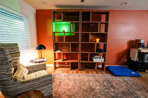 a room with furniture and a book shelf