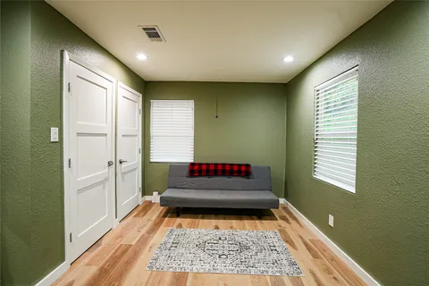 a room with window and a rug