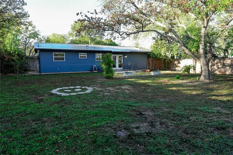 a front view of a house with porch yard
