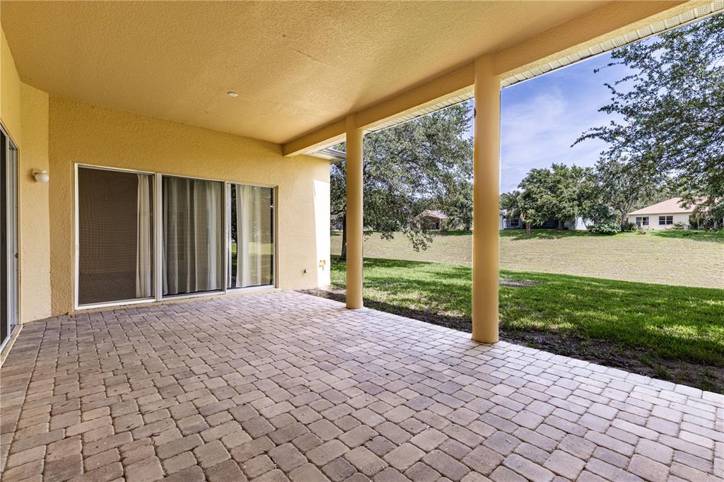 2718 Knightsbridge Road Clermont, FL 34711 - Photo 37 of 72 a view of a house with backyard and garden