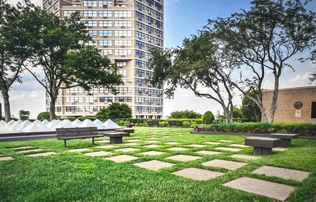 an aerial view of a house with a yard basket ball court and outdoor seating
