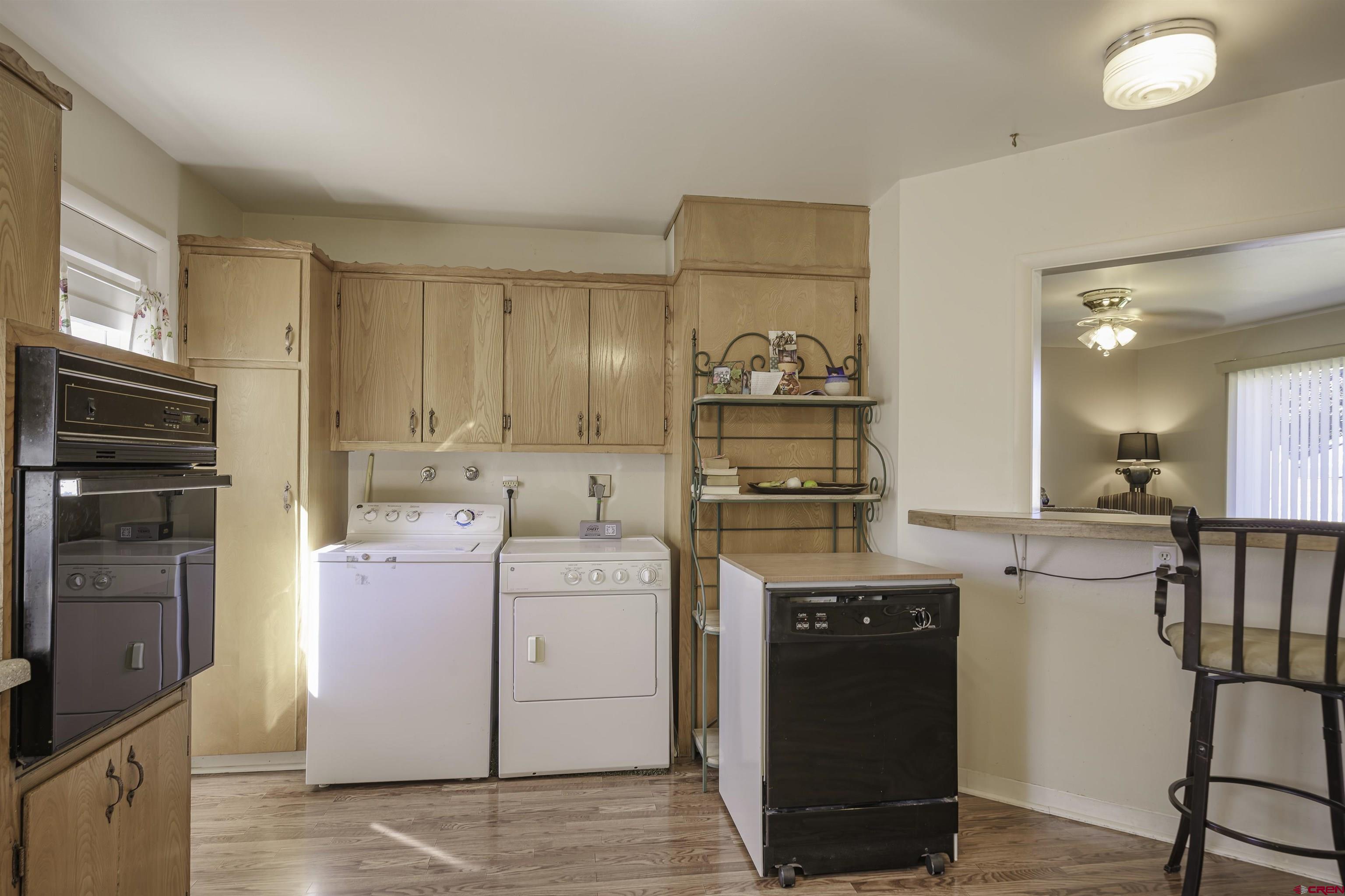 1002 East 2nd Street Florence, CO 81226 - Photo 12 of 44 a kitchen with a stove and a refrigerator