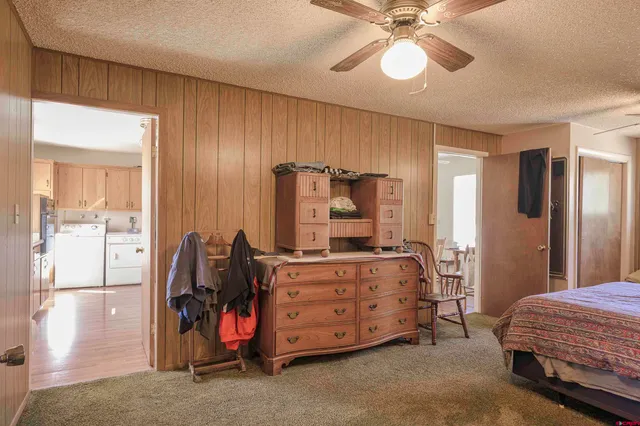 a bathroom with a sink a toilet and shower curtain