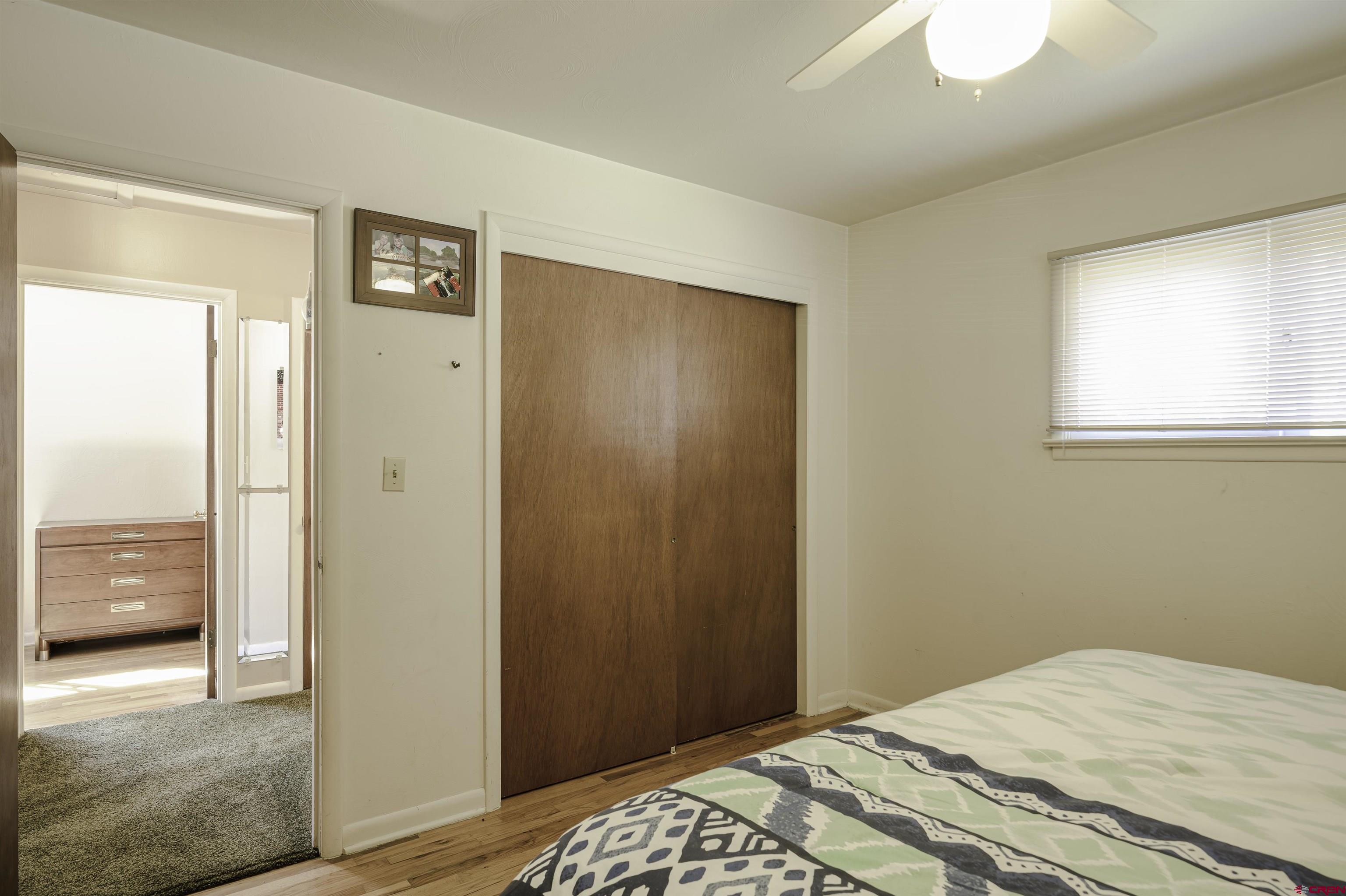 1002 East 2nd Street Florence, CO 81226 - Photo 23 of 44 a bedroom with a bed and a window