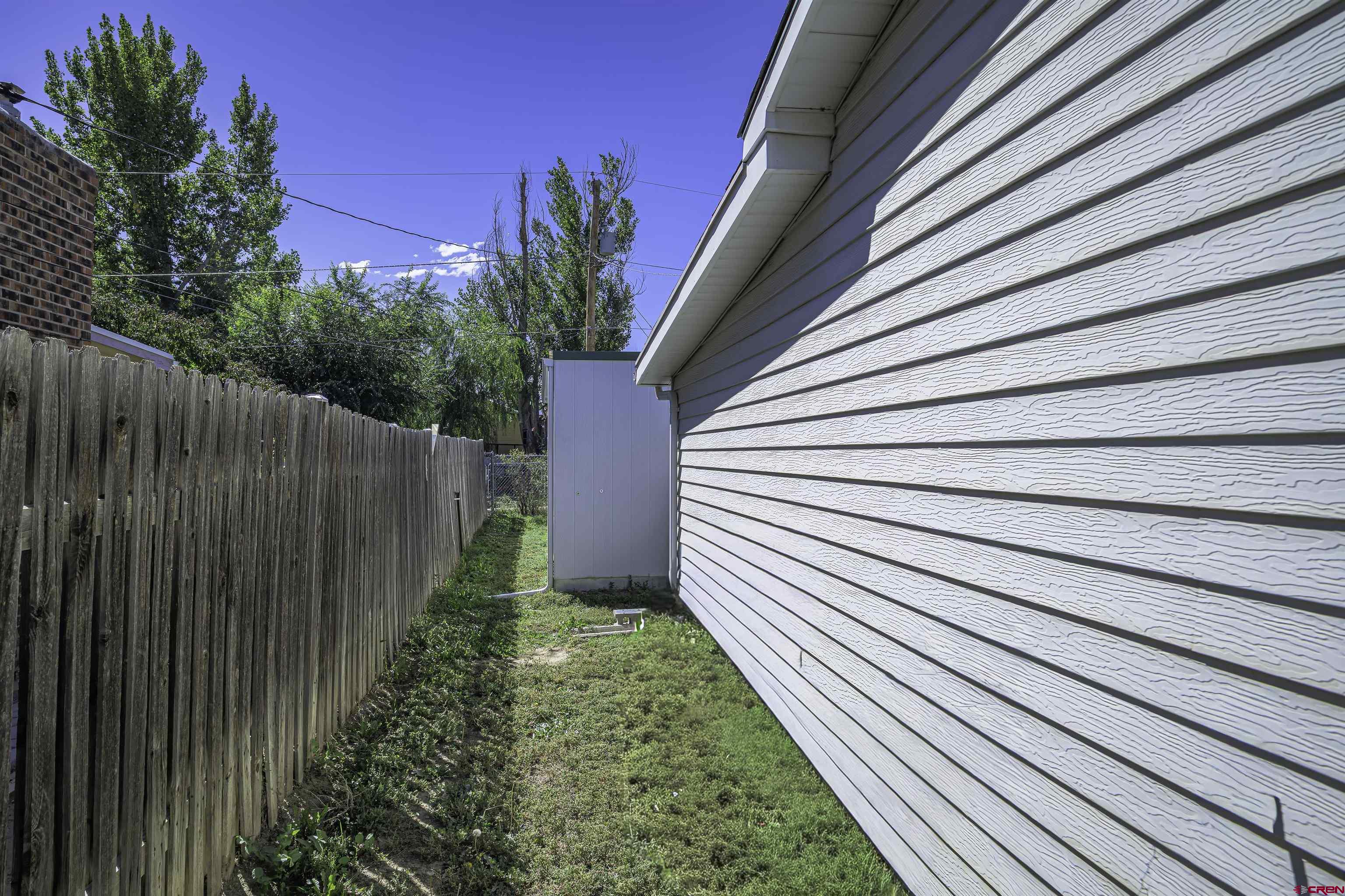1002 East 2nd Street Florence, CO 81226 - Photo 28 of 44 a view of a backyard with pathway