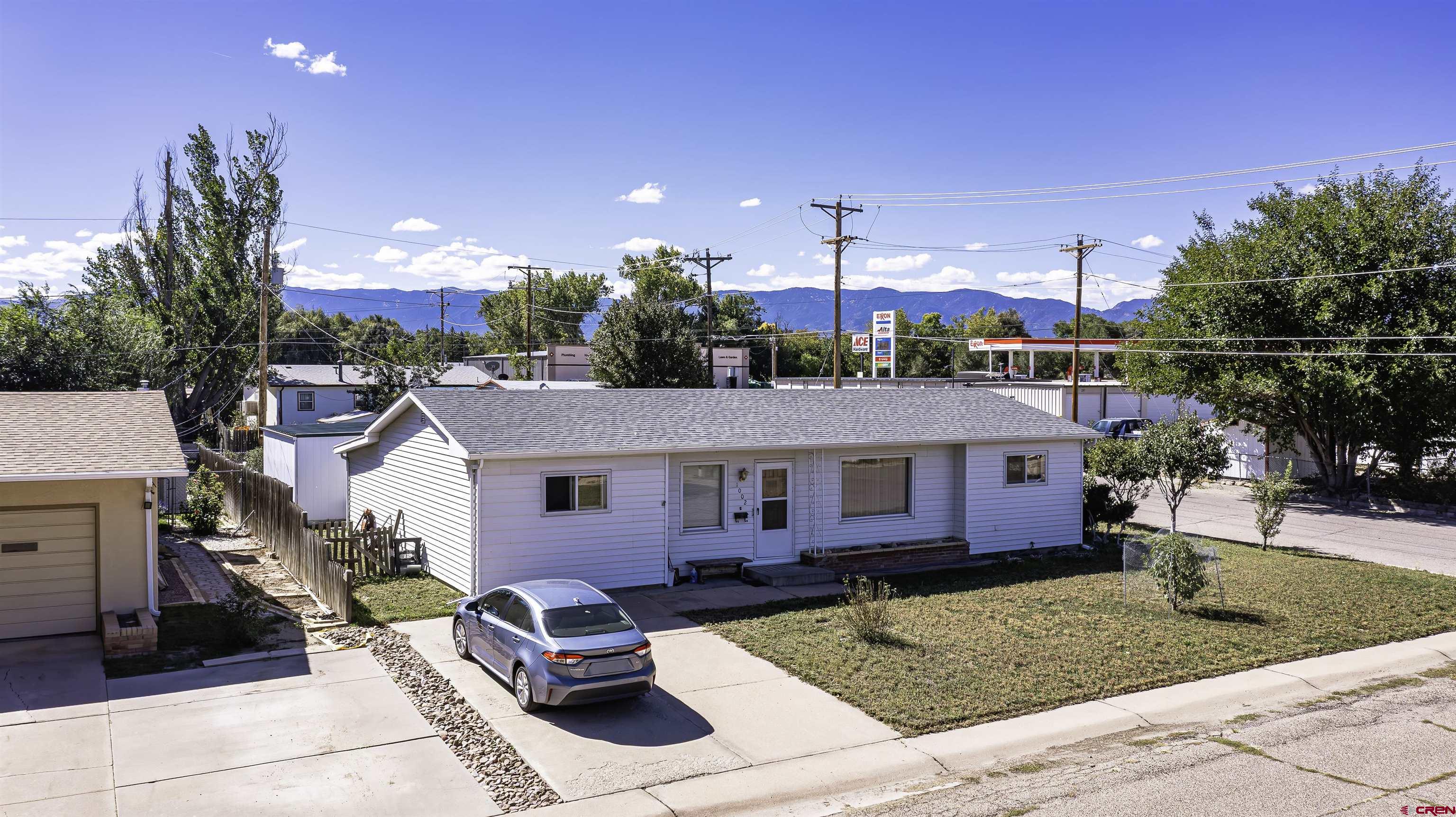 1002 East 2nd Street Florence, CO 81226 - Photo 3 of 44 a front view of a house with a yard