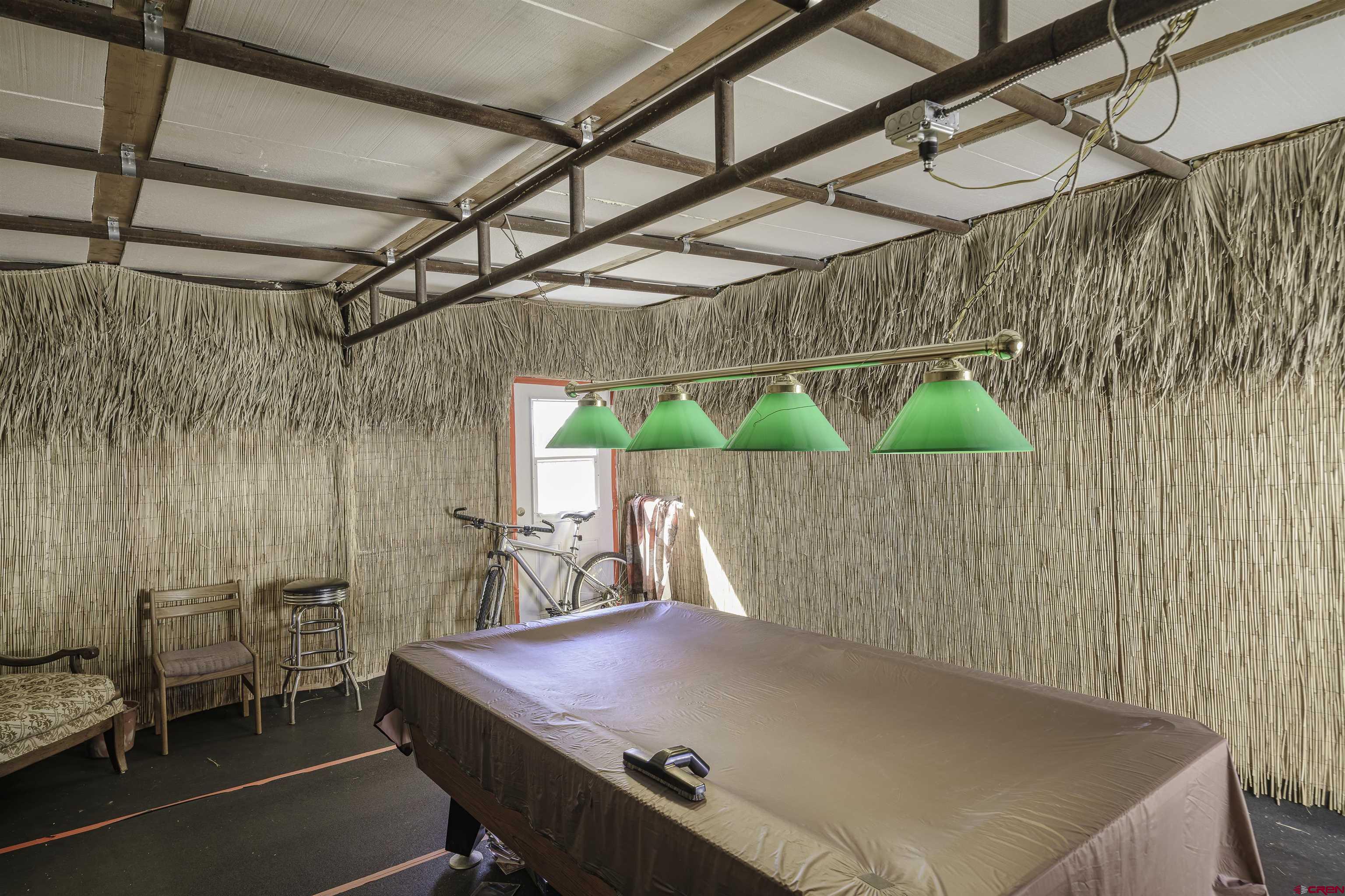 1002 East 2nd Street Florence, CO 81226 - Photo 33 of 44 a bed sitting in a wooden room