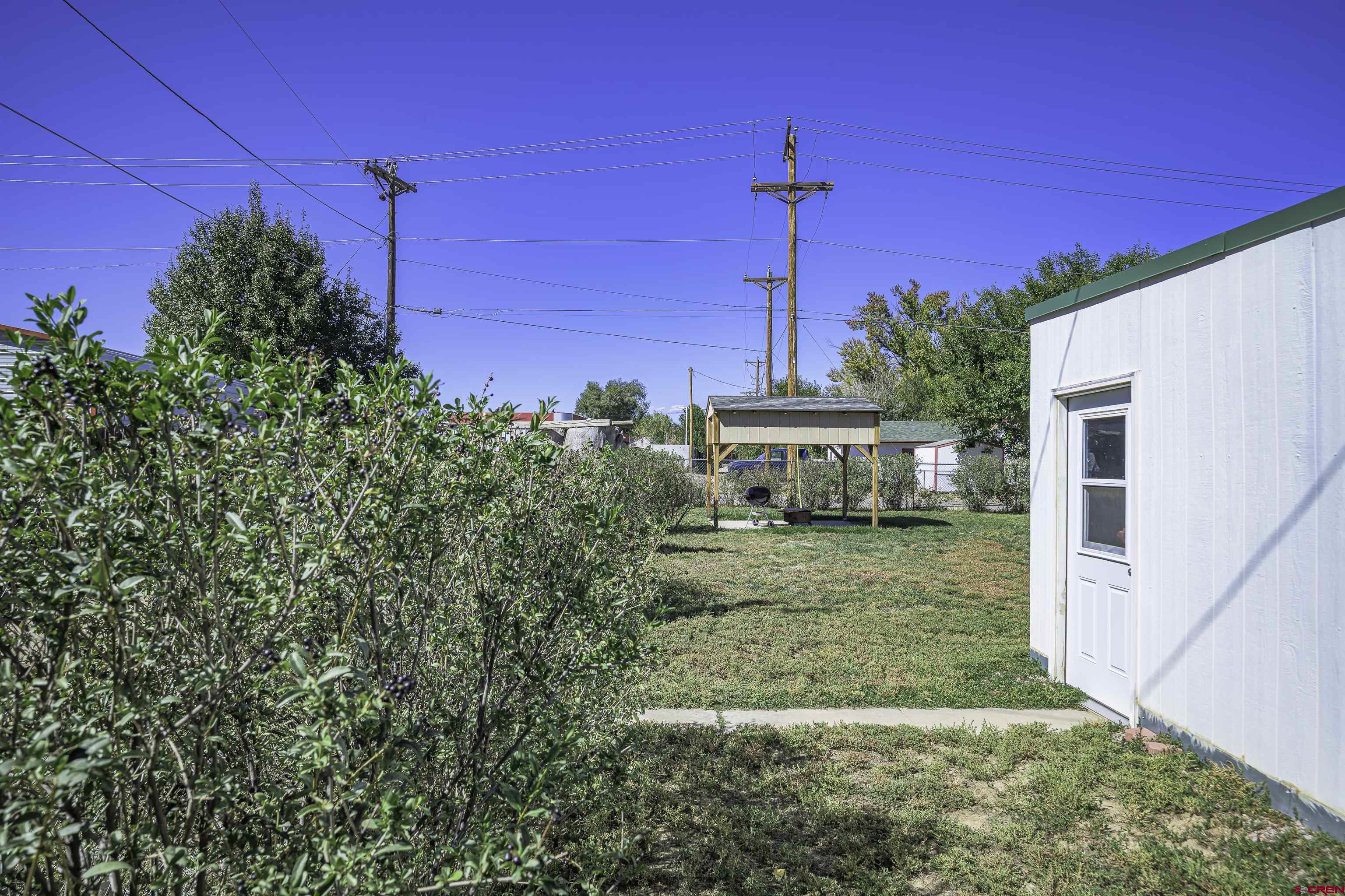 1002 East 2nd Street Florence, CO 81226 - Photo 35 of 44 a view of a house with a yard