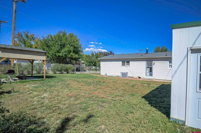 a view of a back yard of the house