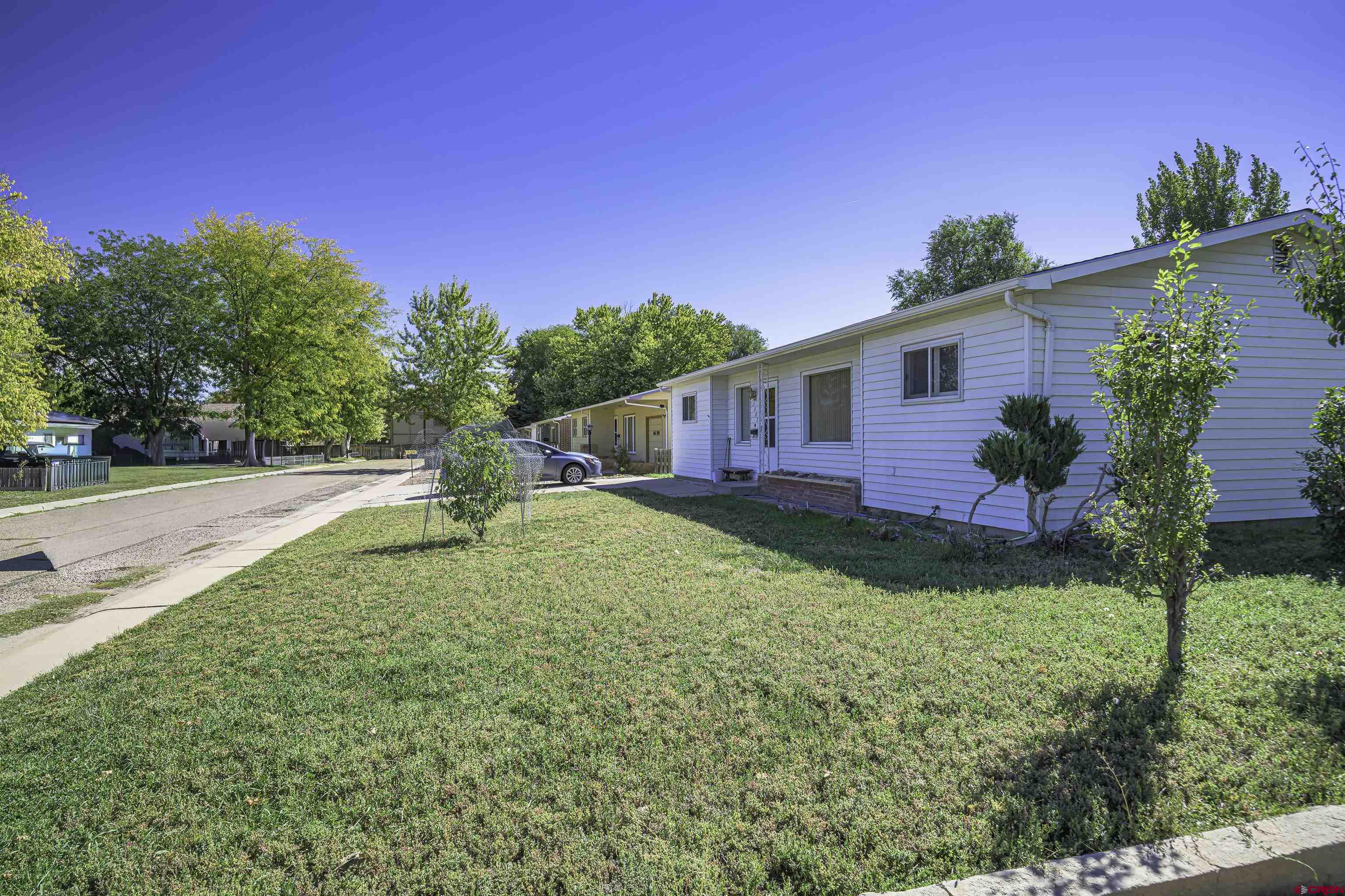 1002 East 2nd Street Florence, CO 81226 - Photo 42 of 44 a view of a house with backyard and sitting area