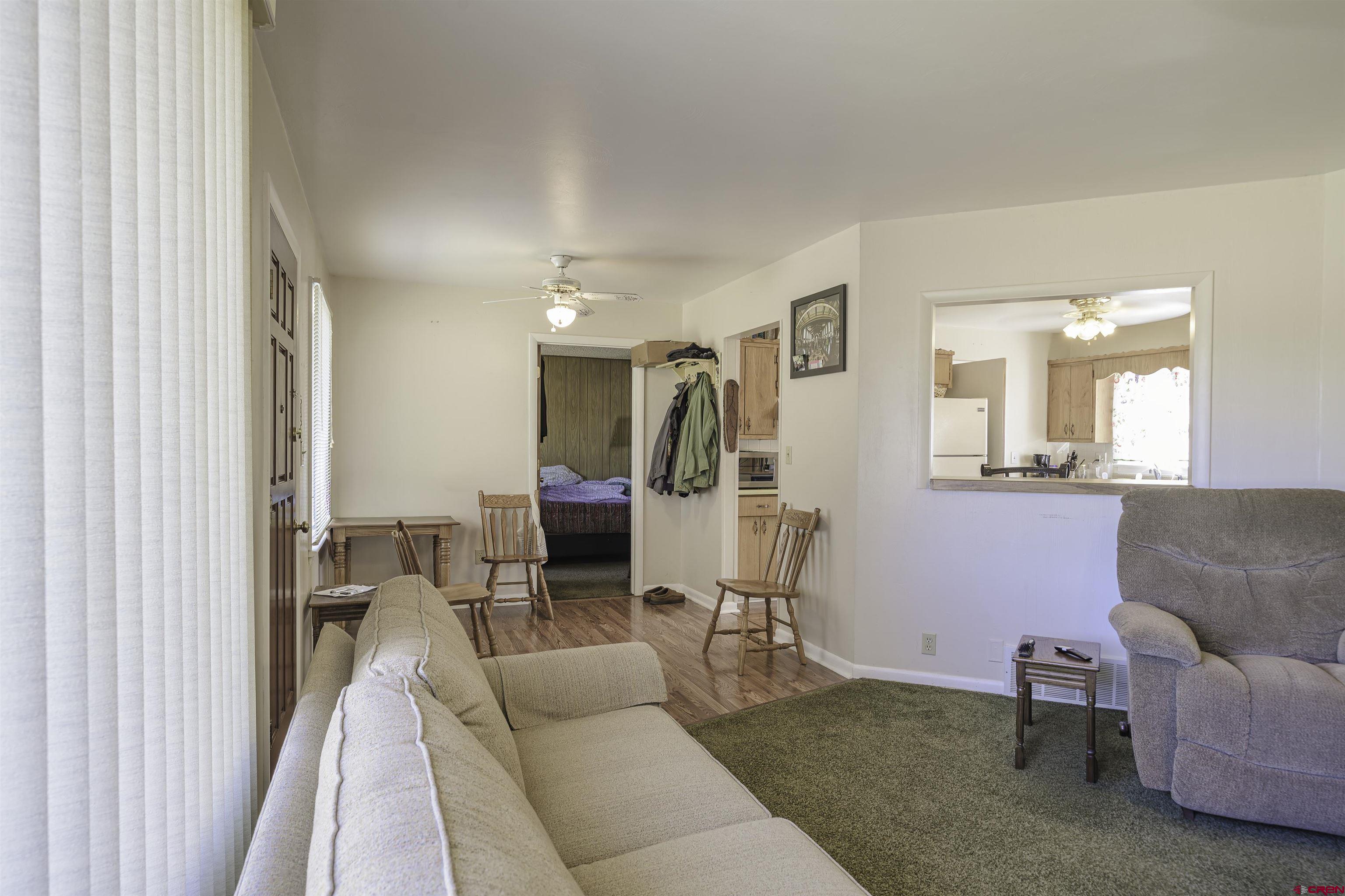 1002 East 2nd Street Florence, CO 81226 - Photo 7 of 44 a living room with furniture and a couch