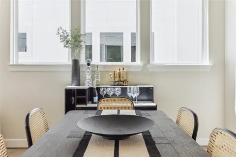 a bathroom with a sink and a chair
