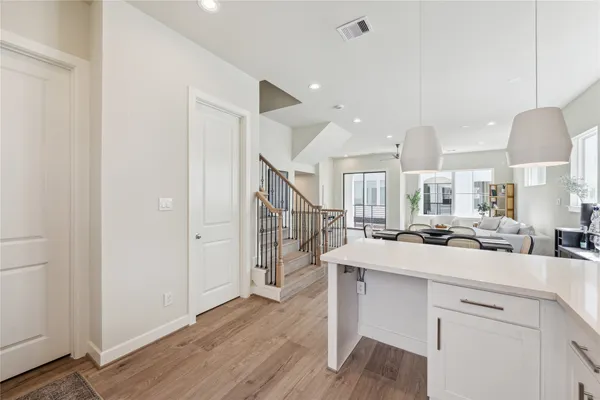 a kitchen with a sink appliances and cabinets