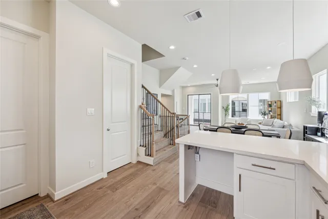 a kitchen with a sink appliances and cabinets