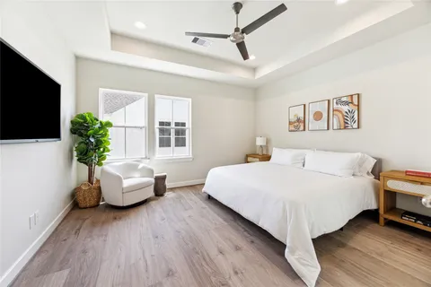 a bedroom with a bed and a couch