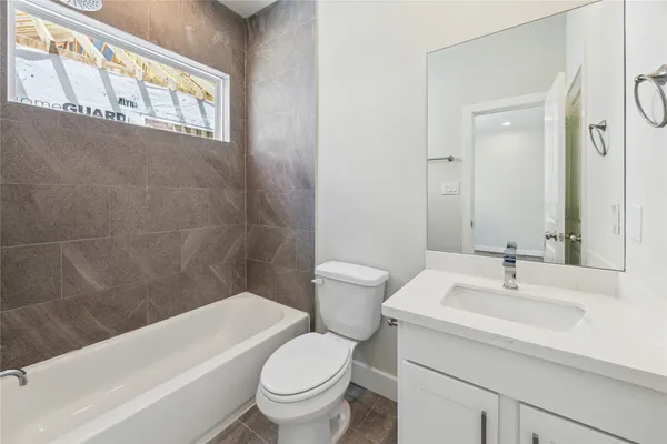 a bathroom with a sink a toilet and a bathtub