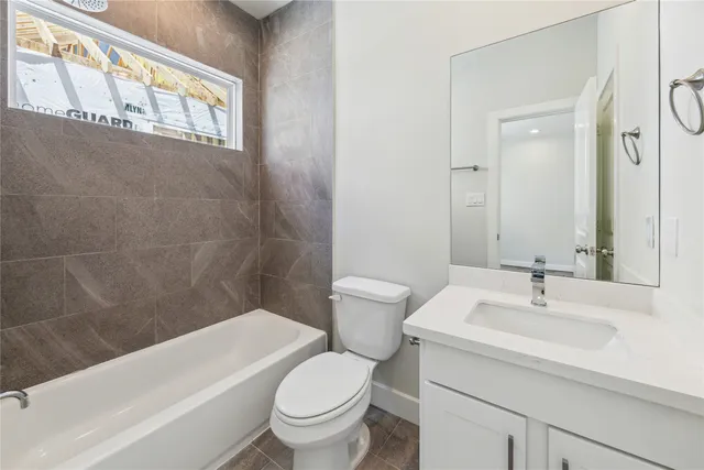 a bathroom with a sink a toilet and a bathtub