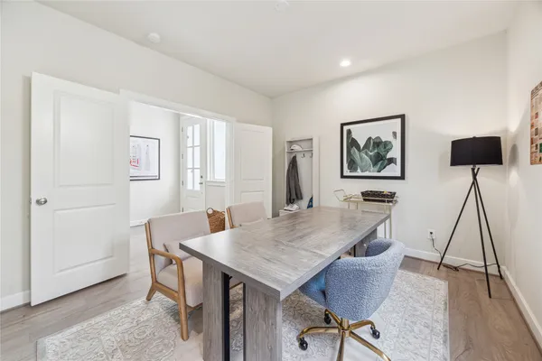 a view of a livingroom with furniture and wooden floor