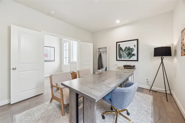 a view of a livingroom with furniture and wooden floor