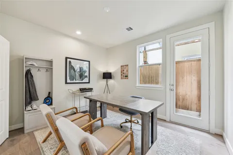 a workspace with furniture and window