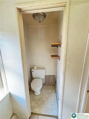a bathroom with a toilet and a sink