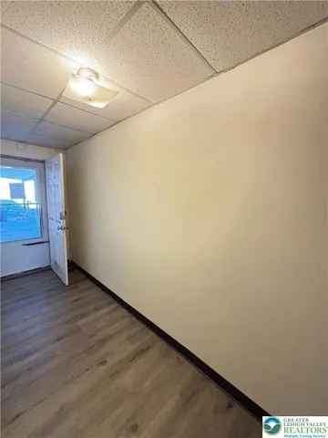 a view of hallway with wooden floor
