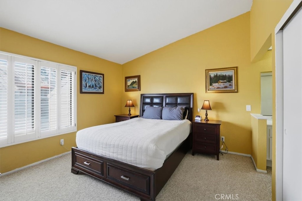 9743 La Jolla Drive, Unit D Rancho Cucamonga, CA 91701 - Photo 21 of 40 a bed sitting in a spacious bedroom next to a window