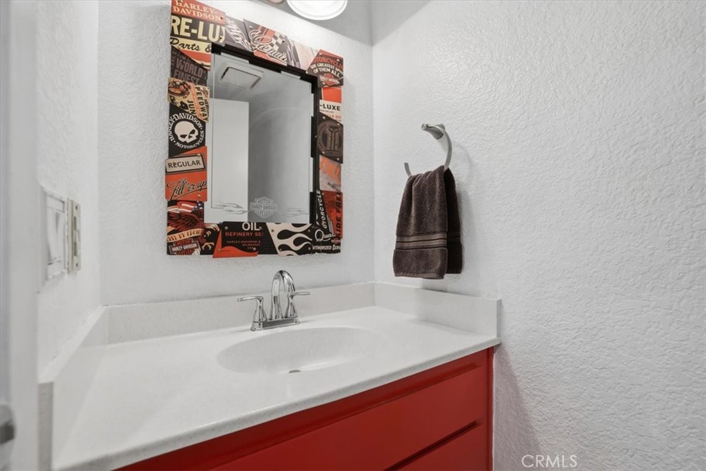9743 La Jolla Drive, Unit D Rancho Cucamonga, CA 91701 - Photo 29 of 40 a bathroom with a sink and a mirror