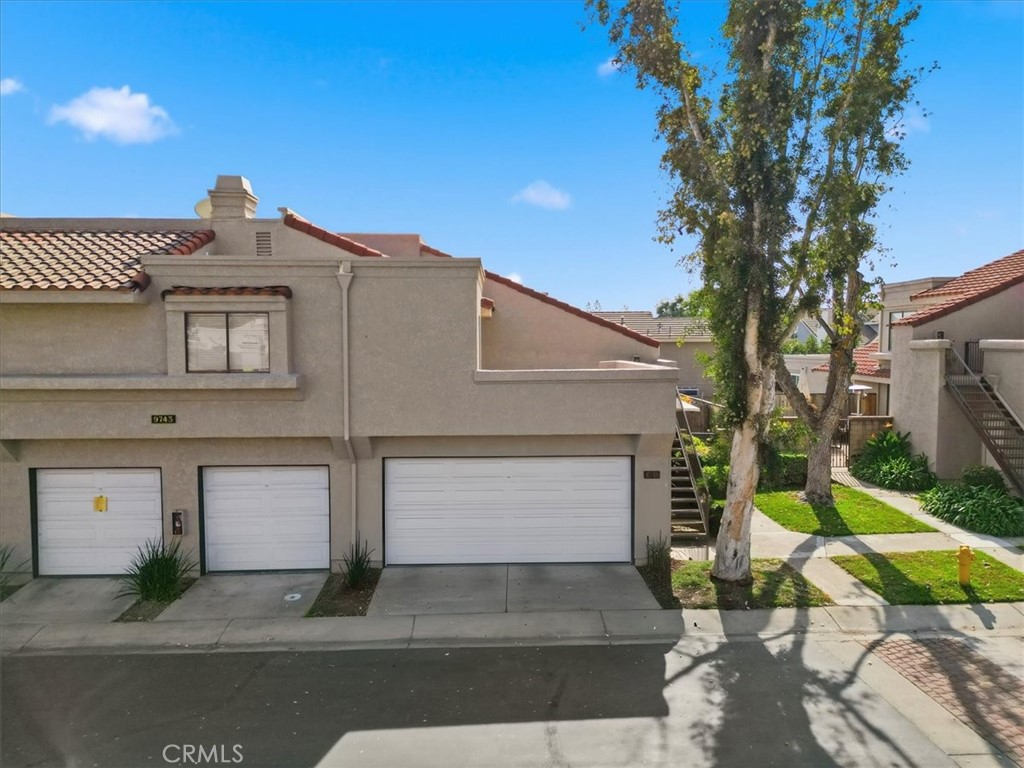 9743 La Jolla Drive, Unit D Rancho Cucamonga, CA 91701 - Photo 30 of 40 a front view of a house with garden