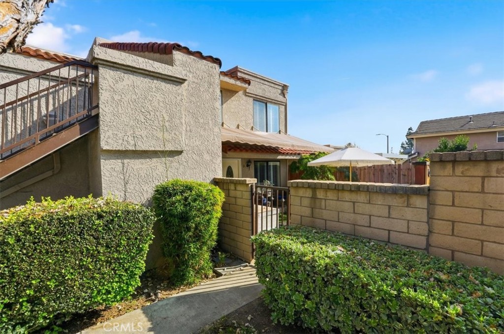 9743 La Jolla Drive, Unit D Rancho Cucamonga, CA 91701 - Photo 31 of 40 a front view of a house with garden