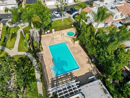 an aerial view of multiple house with yard