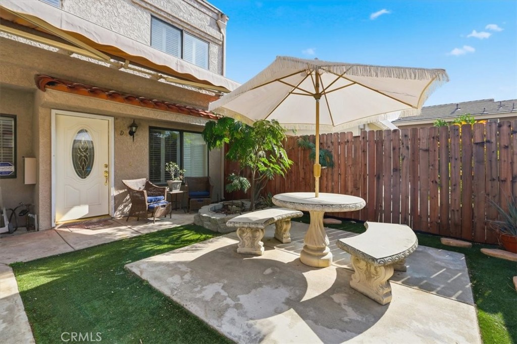 9743 La Jolla Drive, Unit D Rancho Cucamonga, CA 91701 - Photo 4 of 40 a view of a table and chairs in backyard of the house