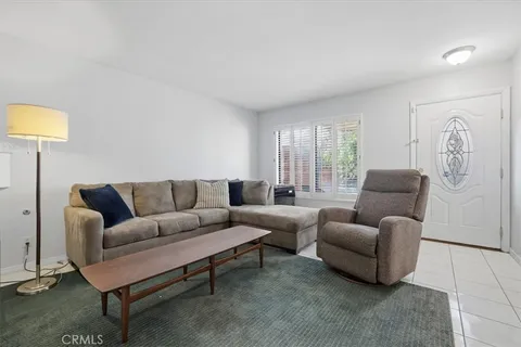 a living room with furniture a couch and a coffee table