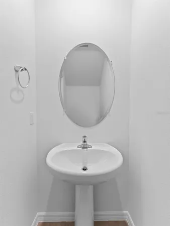 a bathroom with a sink and mirror