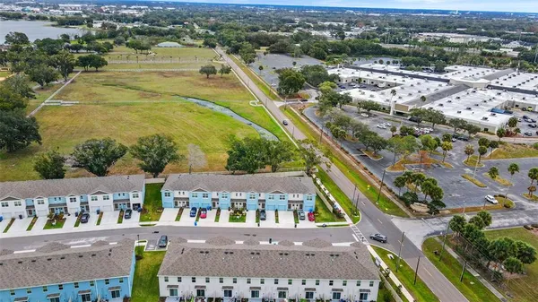 an aerial view of residential houses with outdoor space