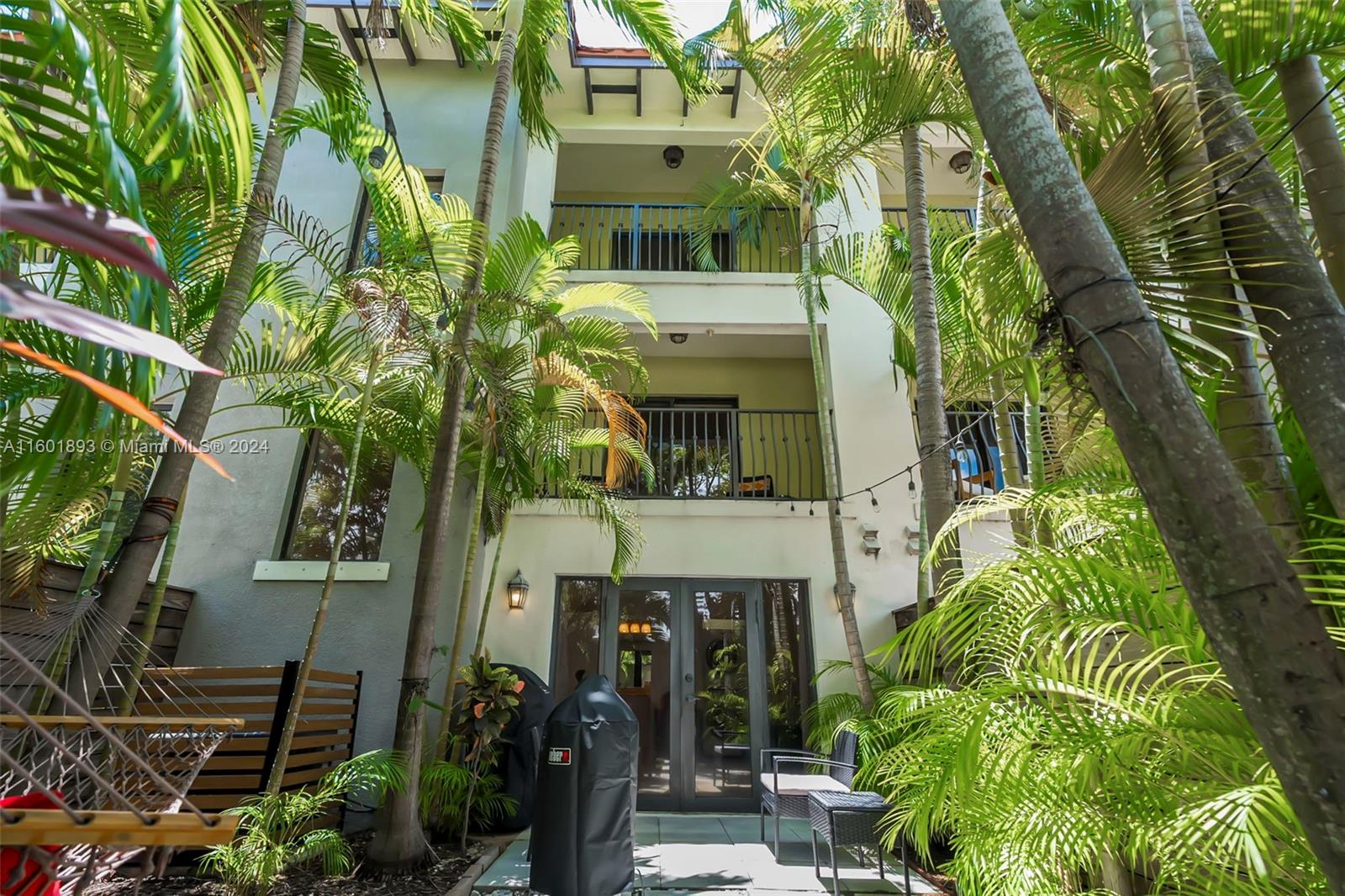 3204 Bird Avenue, Unit 109 Miami, FL 33133 - Photo 11 of 67 a front view of a house with a yard