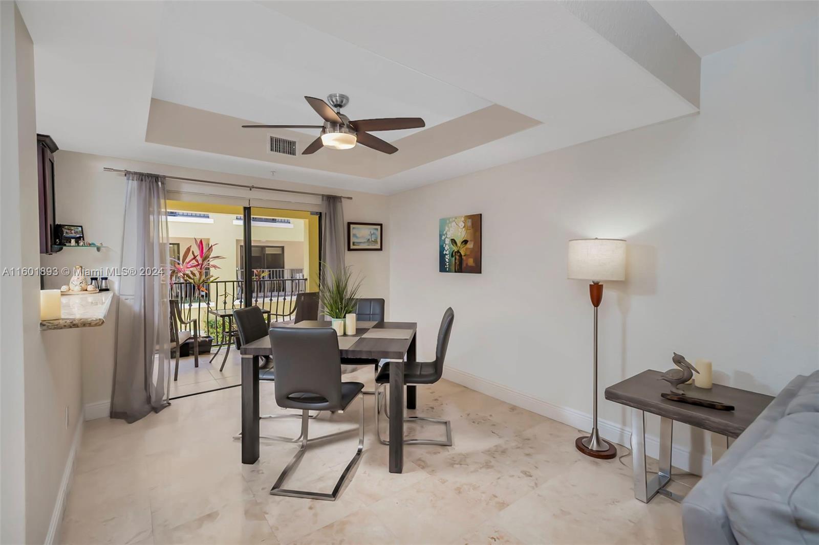 3204 Bird Avenue, Unit 109 Miami, FL 33133 - Photo 14 of 67 a dining room with furniture and a chandelier