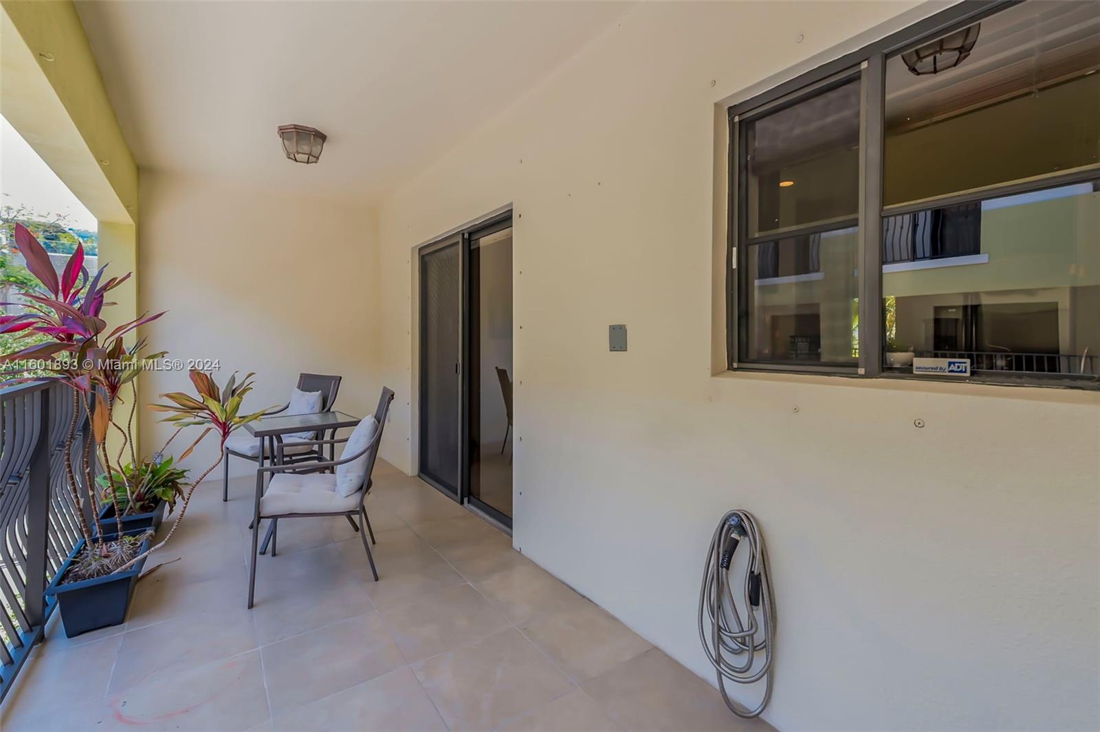 3204 Bird Avenue, Unit 109 Miami, FL 33133 - Photo 31 of 67 a view of a livingroom with furniture and a potted plant
