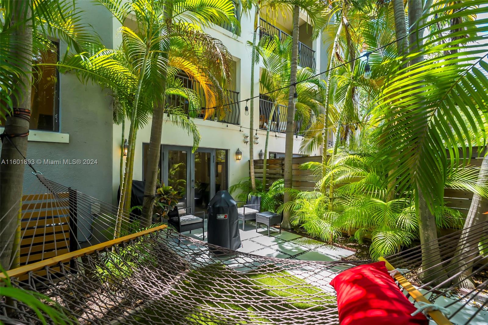 3204 Bird Avenue, Unit 109 Miami, FL 33133 - Photo 36 of 67 a view of a house with plants and porch