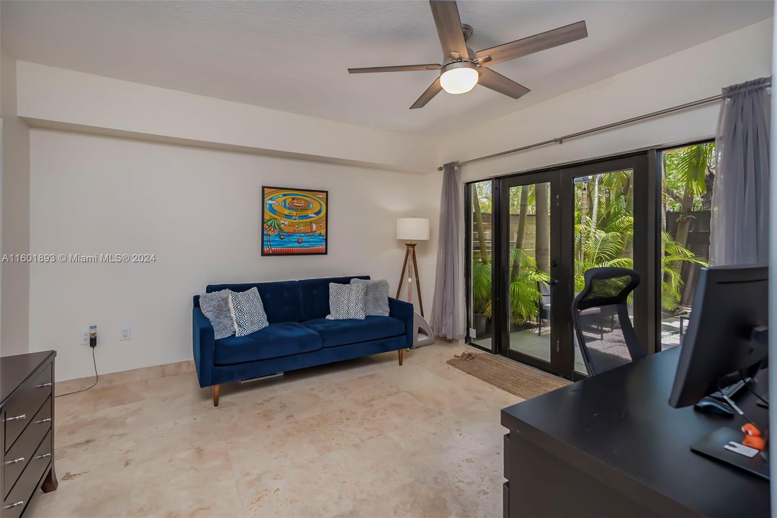 3204 Bird Avenue, Unit 109 Miami, FL 33133 - Photo 5 of 67 a living room with furniture large window and flat screen tv