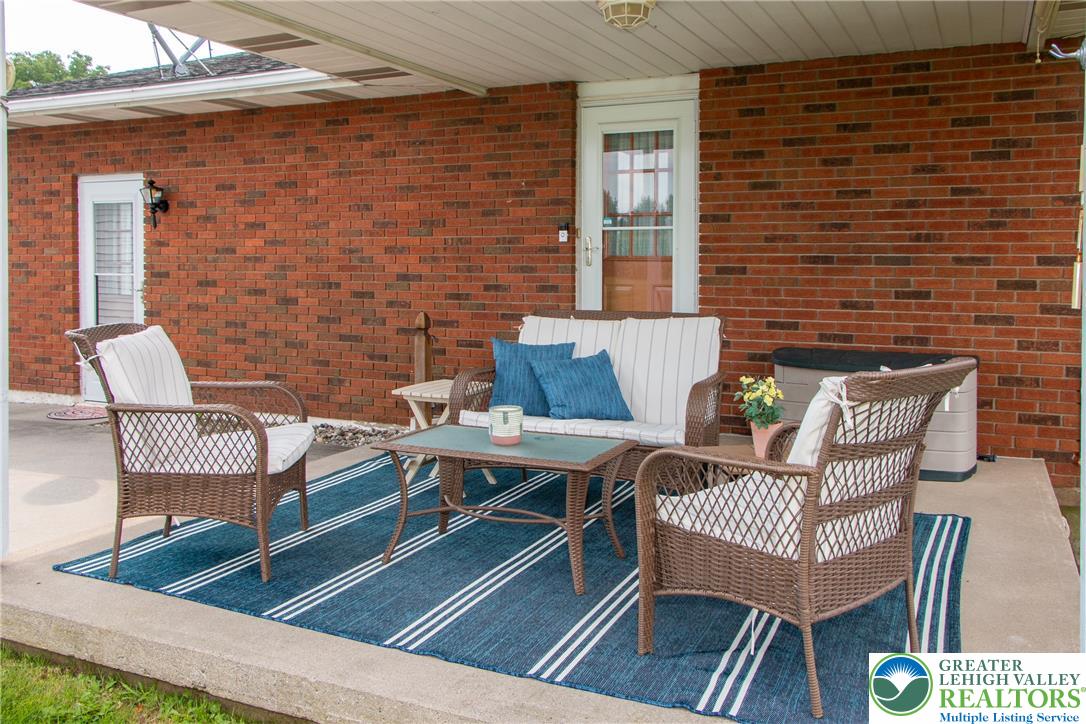 700 Newlins Road East Easton, PA 18040 - Photo 32 of 42 An inviting covered patio features a brick exterior and ample space for relaxation and entertaining.