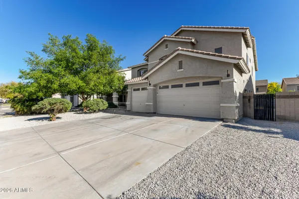 a front view of a house with a garage