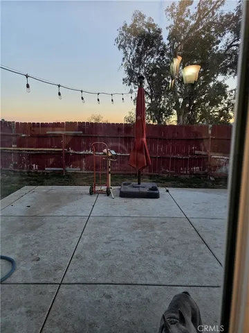 a kitchen with a sink stove top oven and cabinets